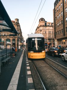 Yellow and Black Bus Near Waiting Shed By Tomer Levi Forex